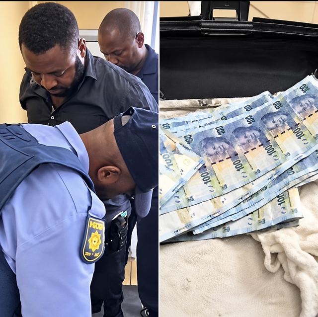 A man being handcuffed by South African police, beside R100 banknotes spread out in an open black bag