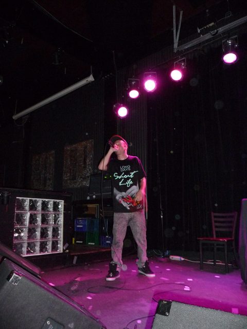Macklemore performing on stage