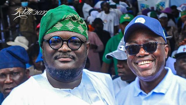 Governor Seyi Makinde, right, in a blue cap and sunglasses, with Rotimi Babajide at a rally