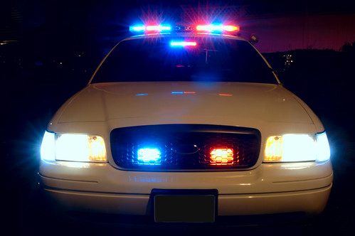 A police car with its lights on at night (stock image)